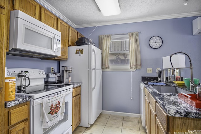 kitchen featuring white appliances, brown cabinetry, a textured ceiling, crown molding, and a sink