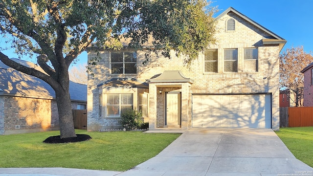 traditional home with brick siding, fence, a garage, driveway, and a front lawn