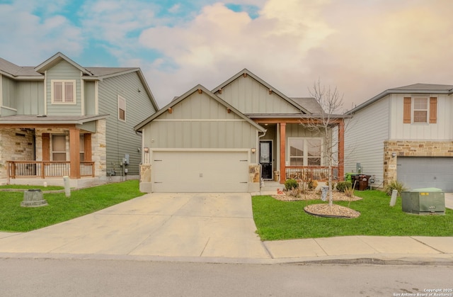 view of front of property with driveway, a porch, board and batten siding, and a front yard