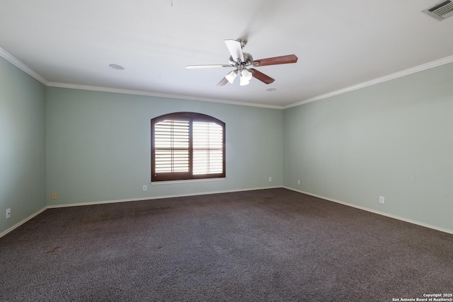 unfurnished room with ornamental molding, dark colored carpet, visible vents, and a ceiling fan