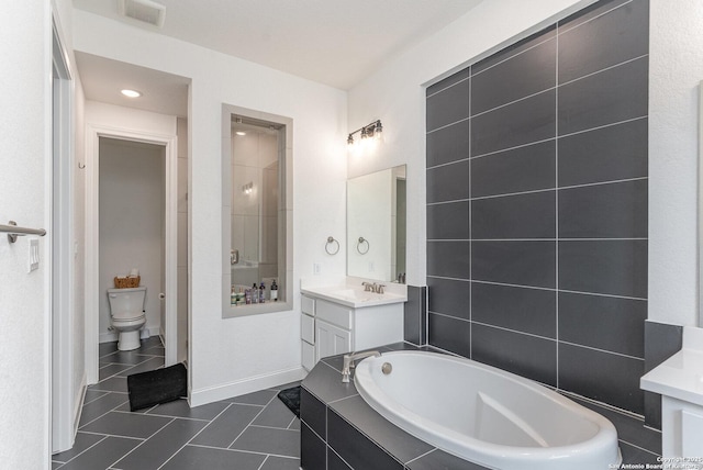 full bath with visible vents, toilet, tile patterned floors, vanity, and a bath