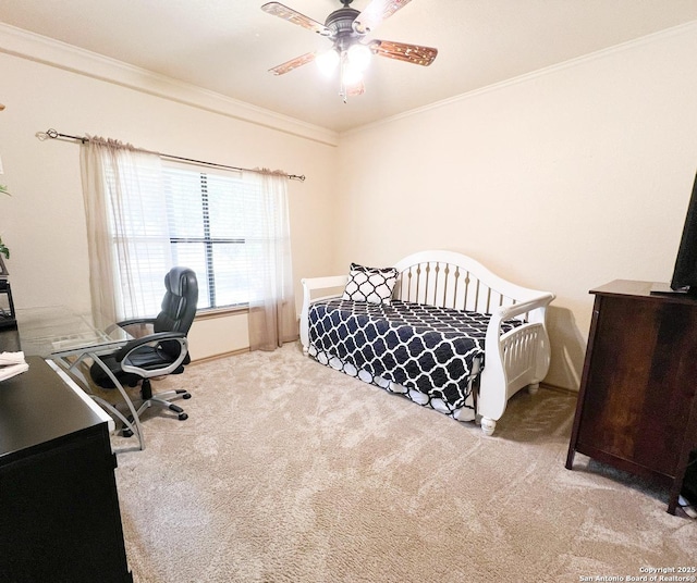 bedroom featuring ornamental molding, light carpet, and ceiling fan