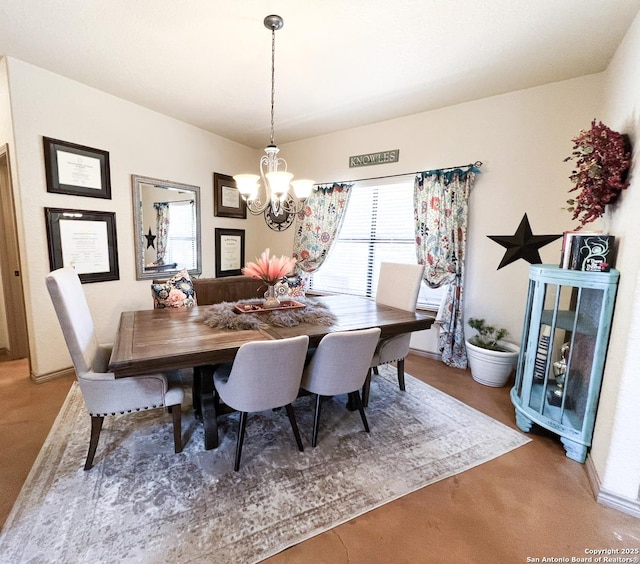 dining space featuring a notable chandelier