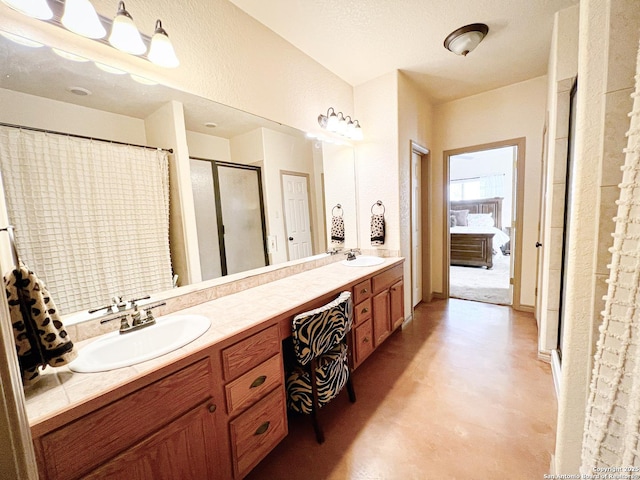 ensuite bathroom featuring double vanity, ensuite bath, a shower with shower curtain, and a sink