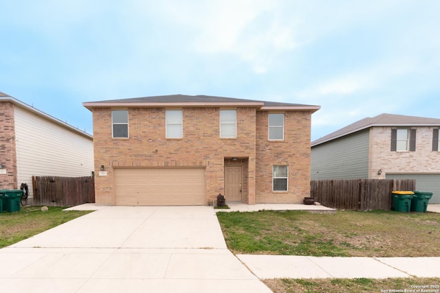 traditional home with brick siding, driveway, an attached garage, and fence