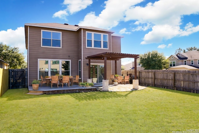 back of property featuring a deck, a lawn, a fenced backyard, and a pergola