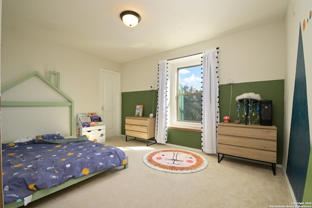 carpeted bedroom featuring baseboards