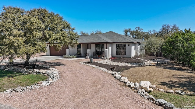 view of front of home featuring a garage and concrete driveway