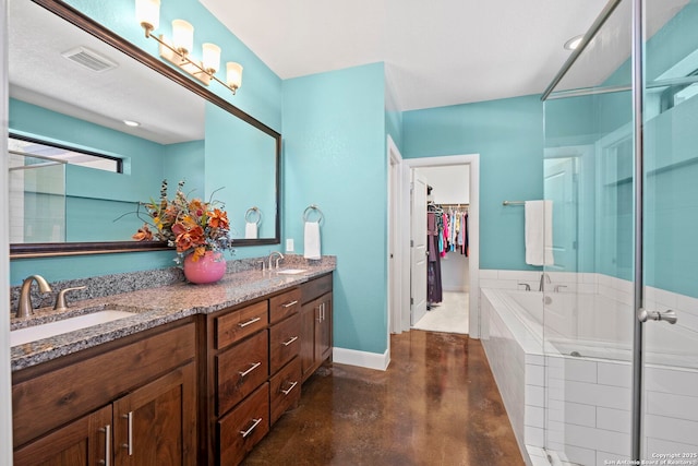 bathroom with a bath, visible vents, concrete floors, and a sink