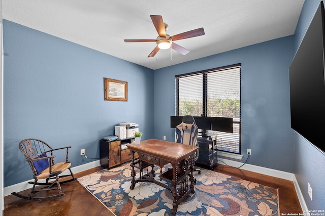 office with baseboards and ceiling fan