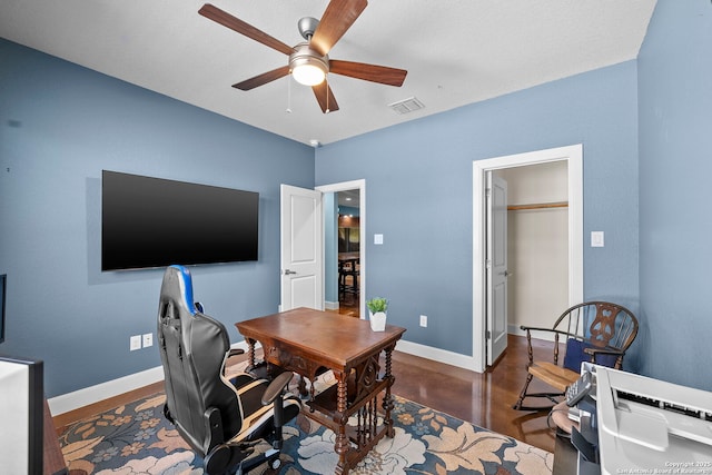 office area with visible vents, baseboards, and a ceiling fan