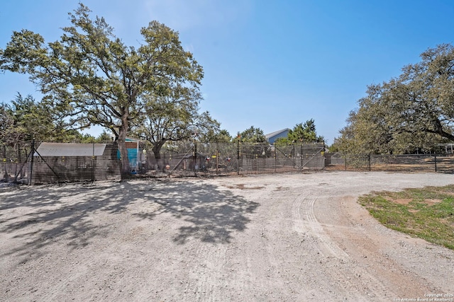 view of street featuring dirt driveway