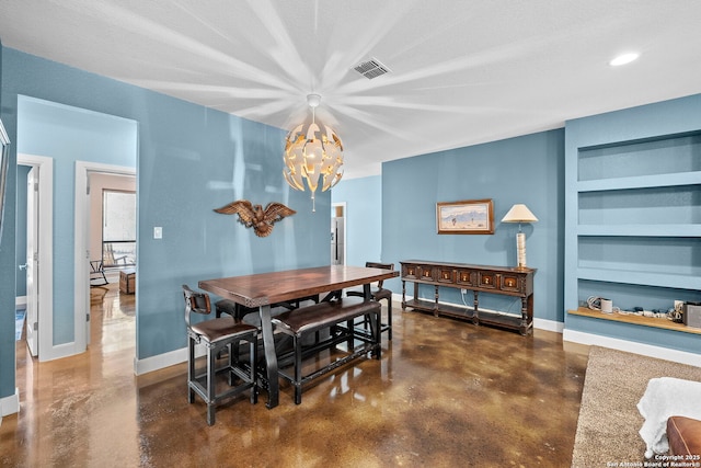 dining area with built in shelves, baseboards, visible vents, concrete floors, and a chandelier