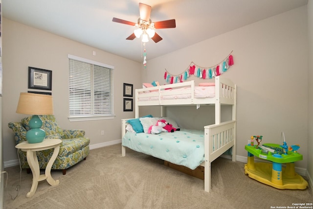 bedroom with a ceiling fan, light colored carpet, and baseboards