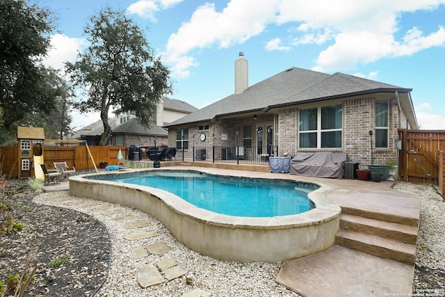 view of swimming pool with a patio, a fenced backyard, and a fenced in pool