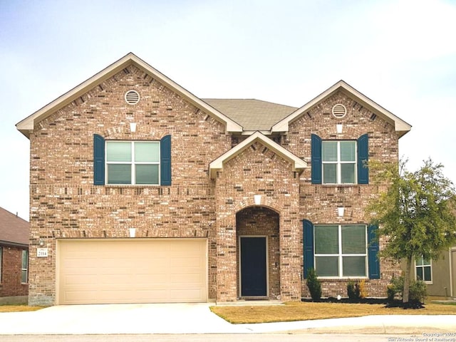 view of front of property with a garage, concrete driveway, and brick siding