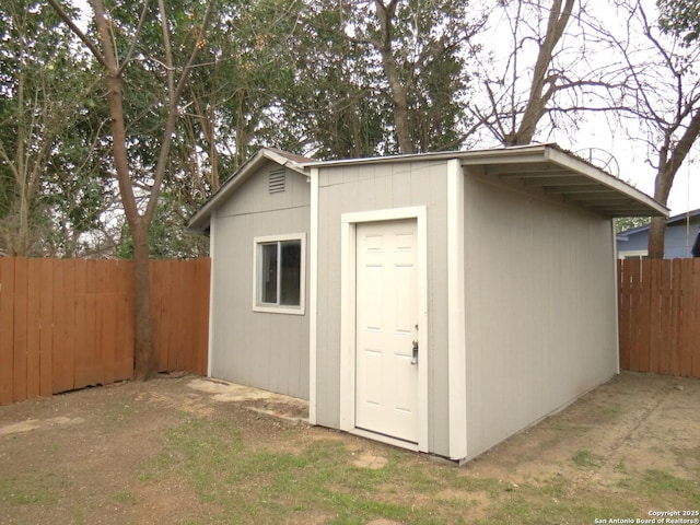 view of shed featuring a fenced backyard