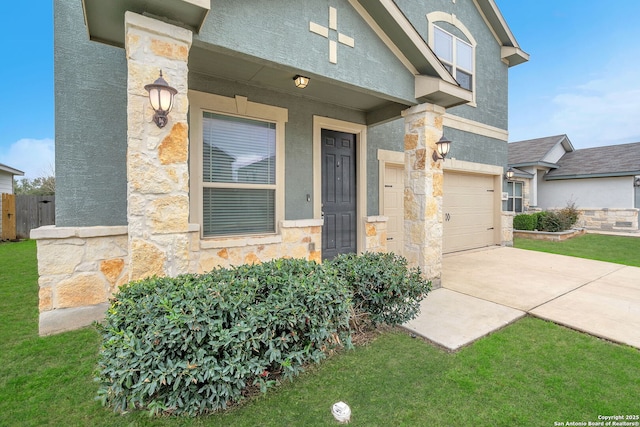 doorway to property featuring a garage, stone siding, driveway, and stucco siding