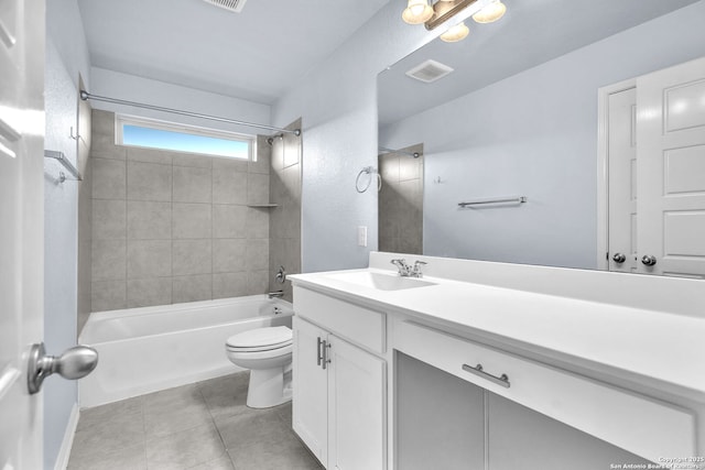 bathroom featuring visible vents, toilet, tile patterned floors, tub / shower combination, and vanity