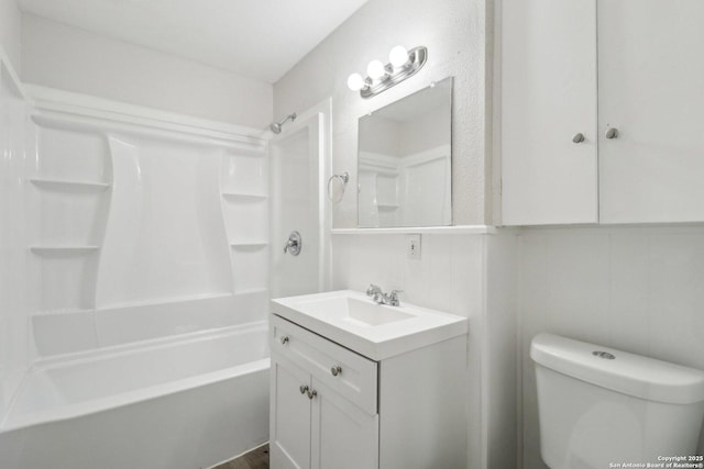 bathroom featuring toilet, shower / bath combination, and vanity