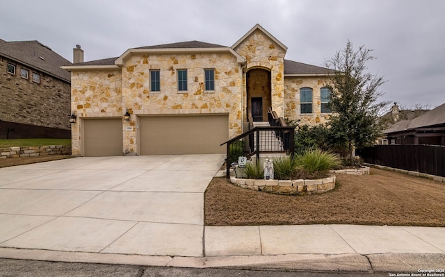 view of front of home with driveway and an attached garage