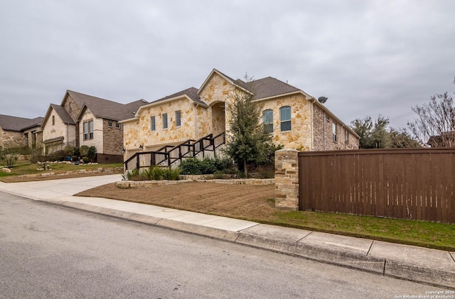 1806 Lawson Rdg, San Antonio, TX 78260 - french country inspired facade with stone siding and concrete driveway