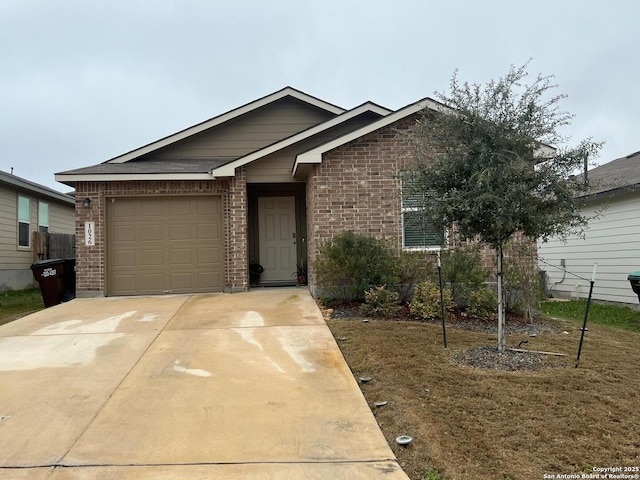 ranch-style home with a garage, driveway, and brick siding