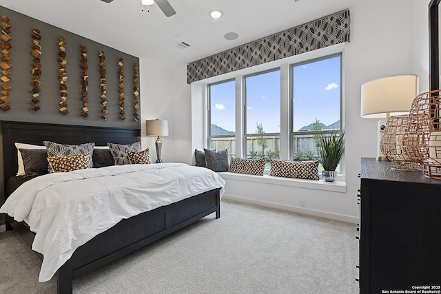 carpeted bedroom with a ceiling fan, recessed lighting, visible vents, and baseboards