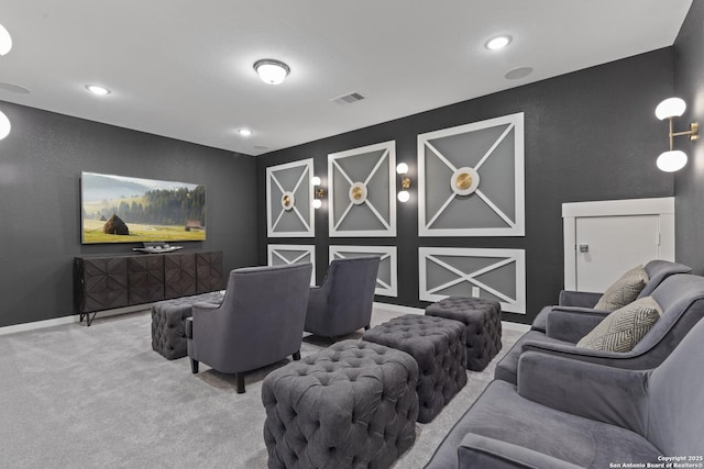 carpeted home theater room featuring recessed lighting, visible vents, and baseboards