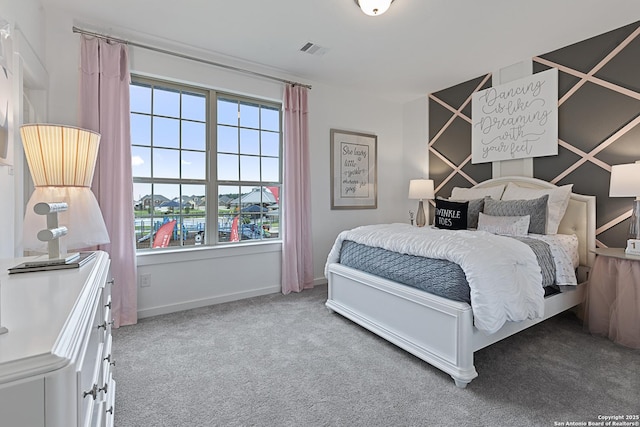 bedroom featuring carpet, visible vents, and baseboards