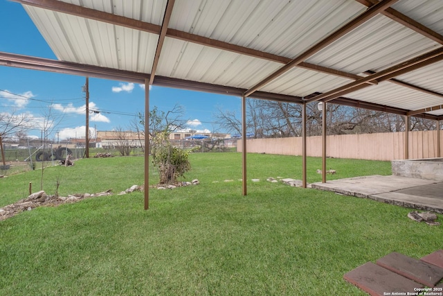 view of yard with fence and a patio