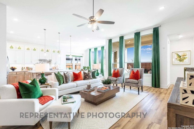 11717 Warlock, San Antonio, TX 78254 - living area featuring a ceiling fan, light wood finished floors, and recessed lighting
