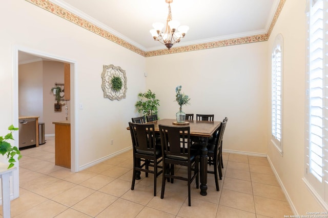 dining room featuring a chandelier, a wealth of natural light, and ornamental molding