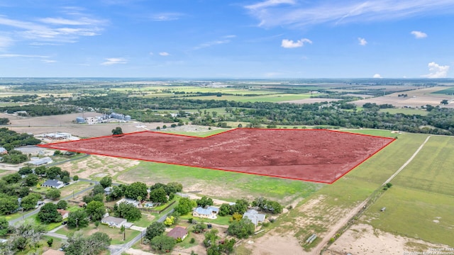 birds eye view of property featuring a rural view