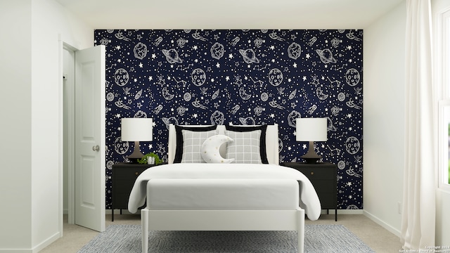 carpeted bedroom featuring wallpapered walls, an accent wall, and baseboards