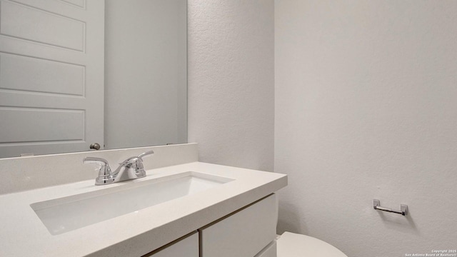 12322 Fort Jyn, San Antonio, TX 78245 - bathroom with a textured wall and vanity