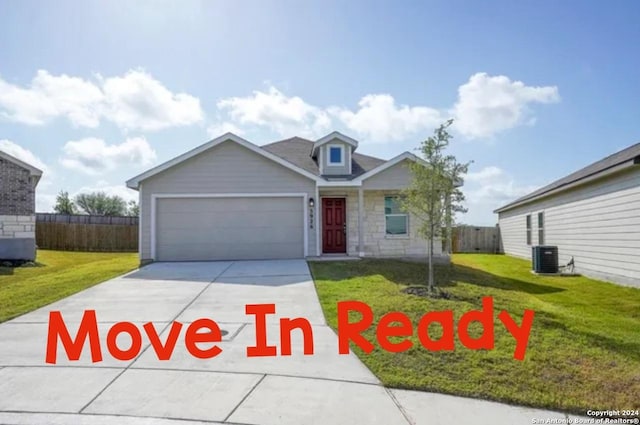 view of front facade with driveway, central AC unit, an attached garage, fence, and a front yard