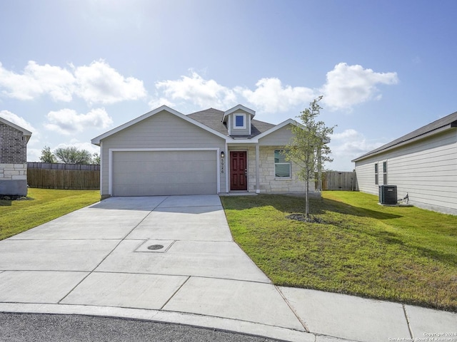 view of front of property with cooling unit, fence, and a front lawn