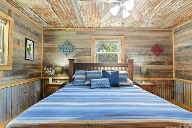 bedroom featuring wooden ceiling and wood walls