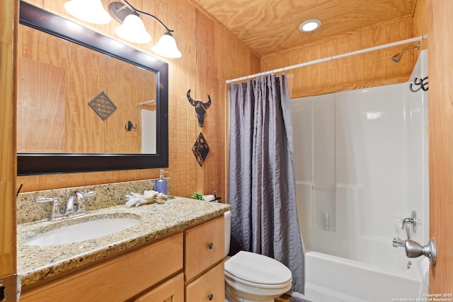 full bathroom with shower / tub combo with curtain, vanity, and toilet