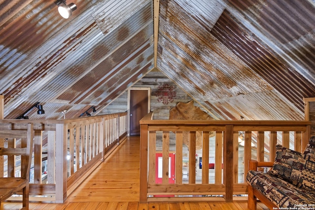 interior space with vaulted ceiling and wood finished floors