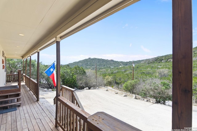 wooden deck with a mountain view