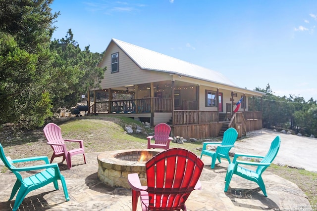 view of patio featuring a fire pit and stairway