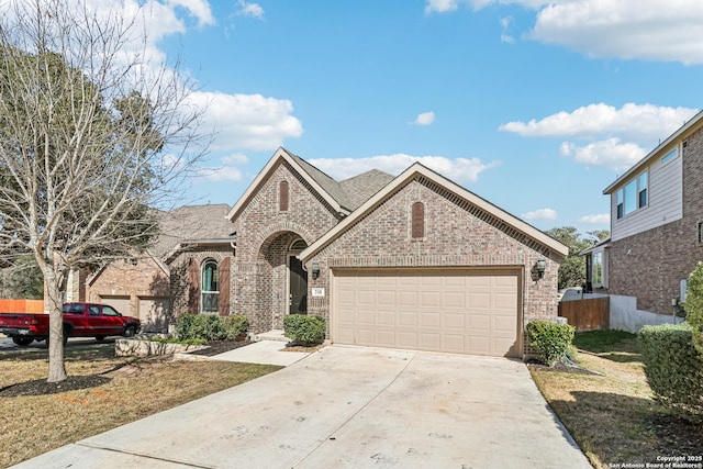 view of front facade with concrete driveway, brick siding, roof with shingles, and an attached garage