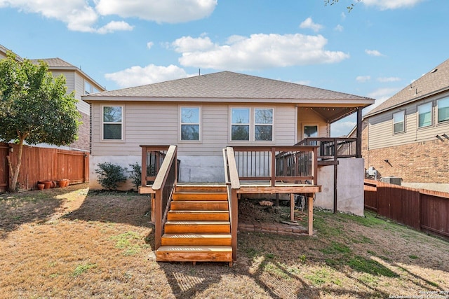 rear view of property with stairs, a shingled roof, a fenced backyard, and a wooden deck