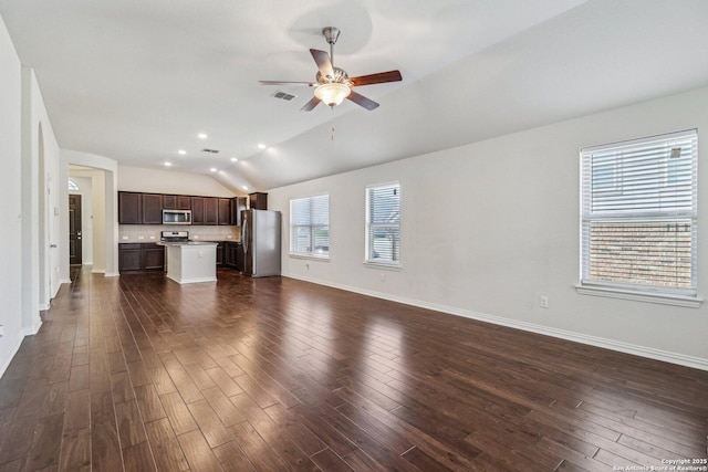 unfurnished living room featuring lofted ceiling, dark wood-style floors, ceiling fan, and visible vents