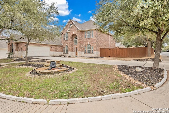 traditional-style home with driveway, a garage, fence, and brick siding