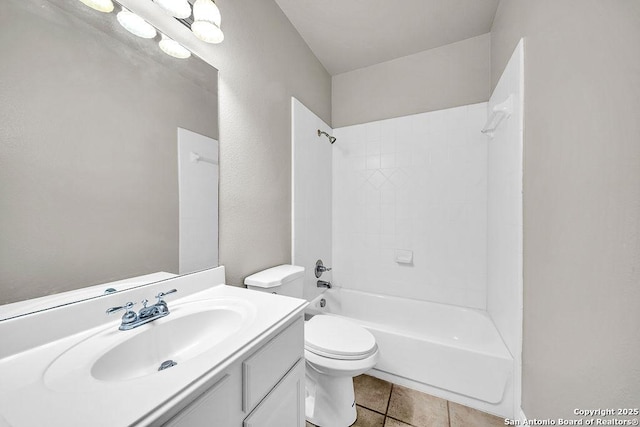 bathroom featuring vanity, bathtub / shower combination, toilet, and tile patterned floors