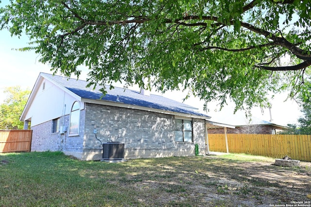 7011 Beech Trl, San Antonio, TX 78244 - back of house with brick siding and cooling unit