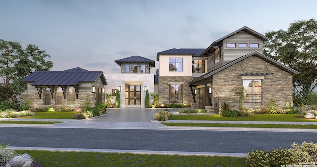 view of front of home with stone siding, a standing seam roof, and metal roof